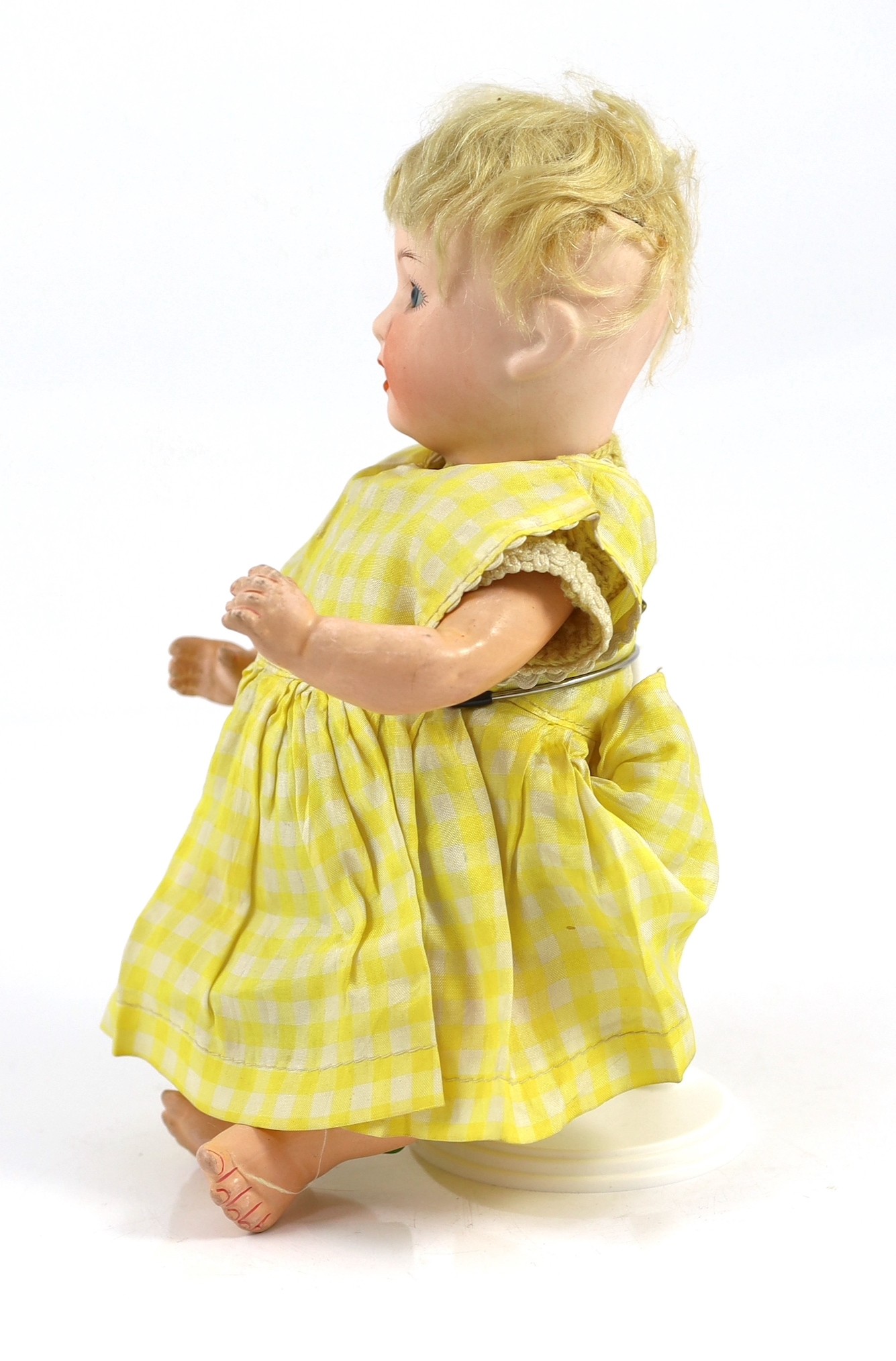 A Heubach Koppelsdorf bisque character doll, German, circa 1910, 12.25in.